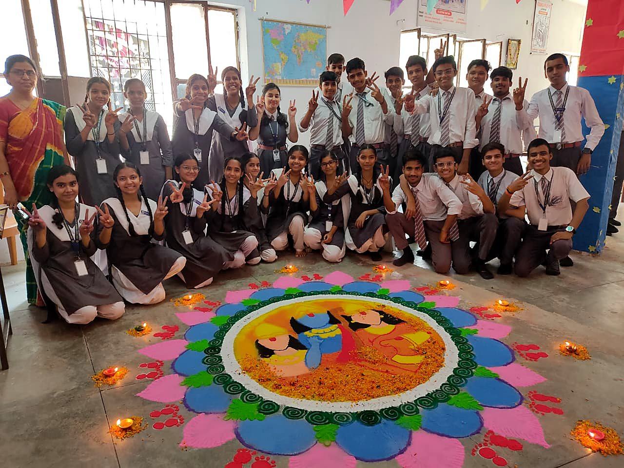 A teacher with her senior students in their classroom